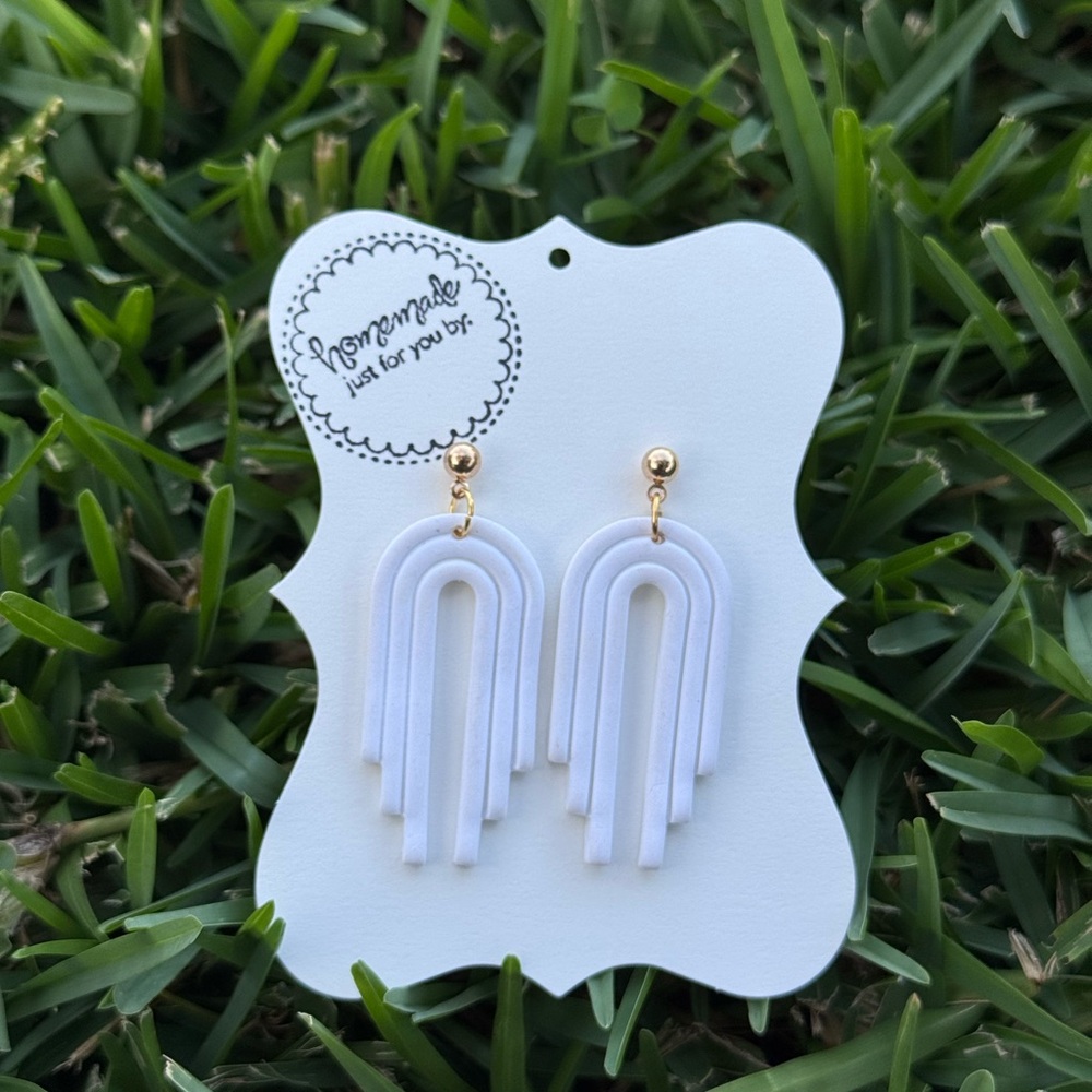 Chic White Arch Earrings with Gold Accents